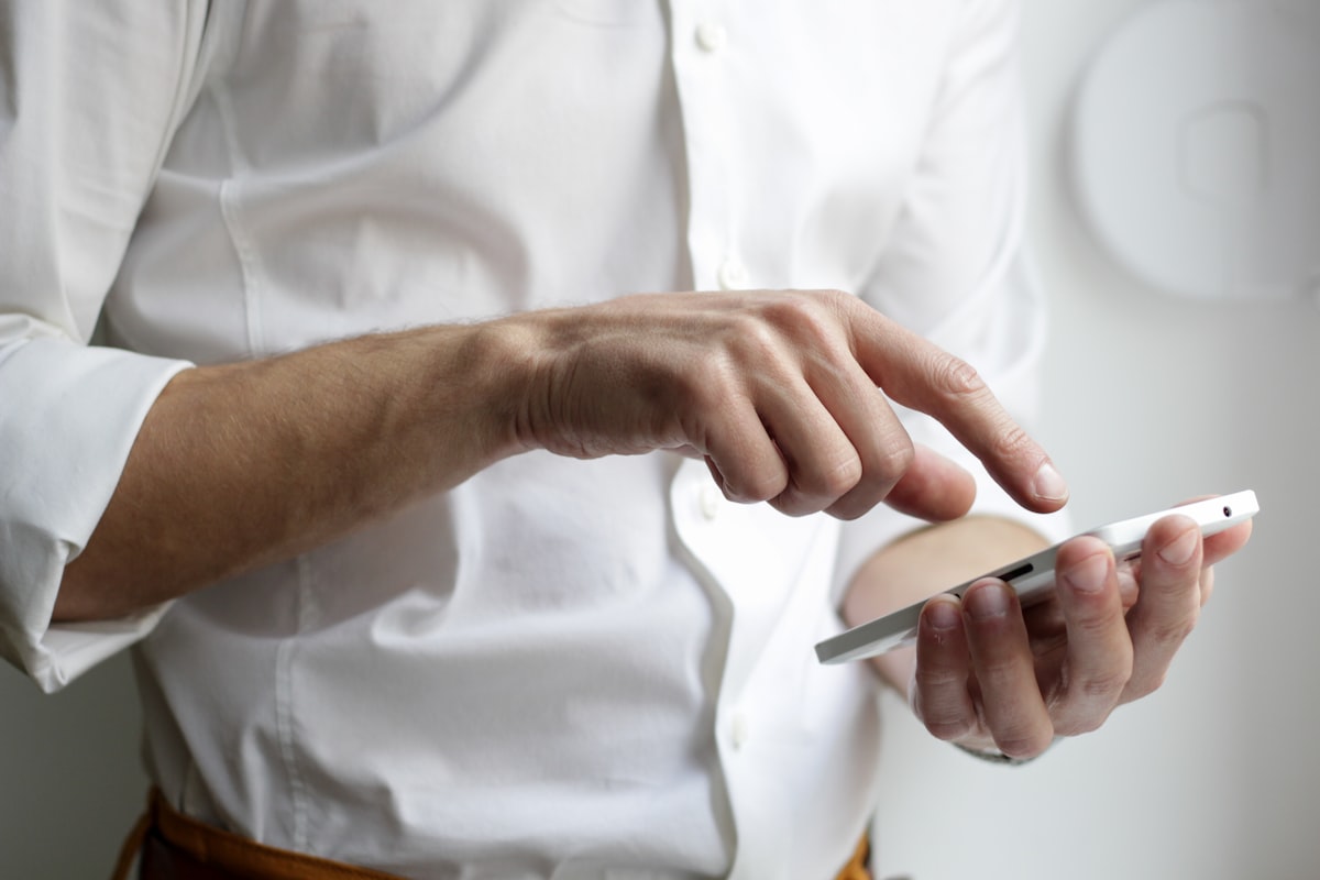 Technician using a smartphone during a device check
