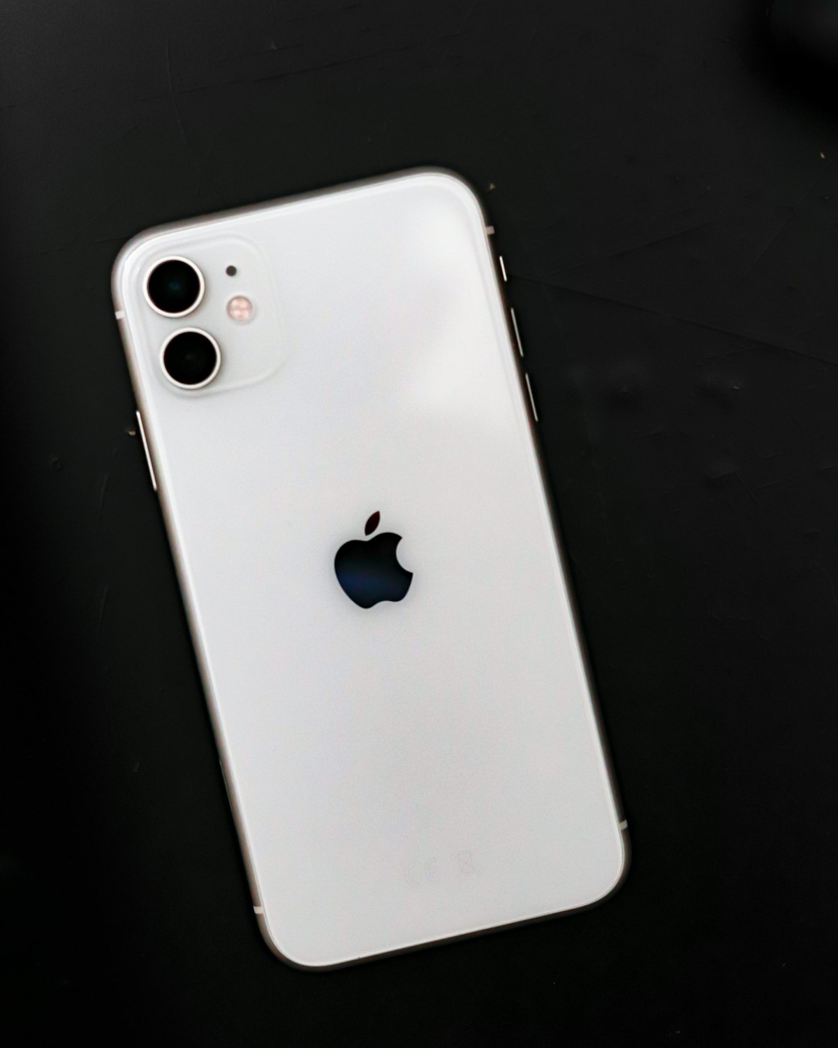 iPhone IMEI check and Apple device lookup iPhone held in hand for IMEI check